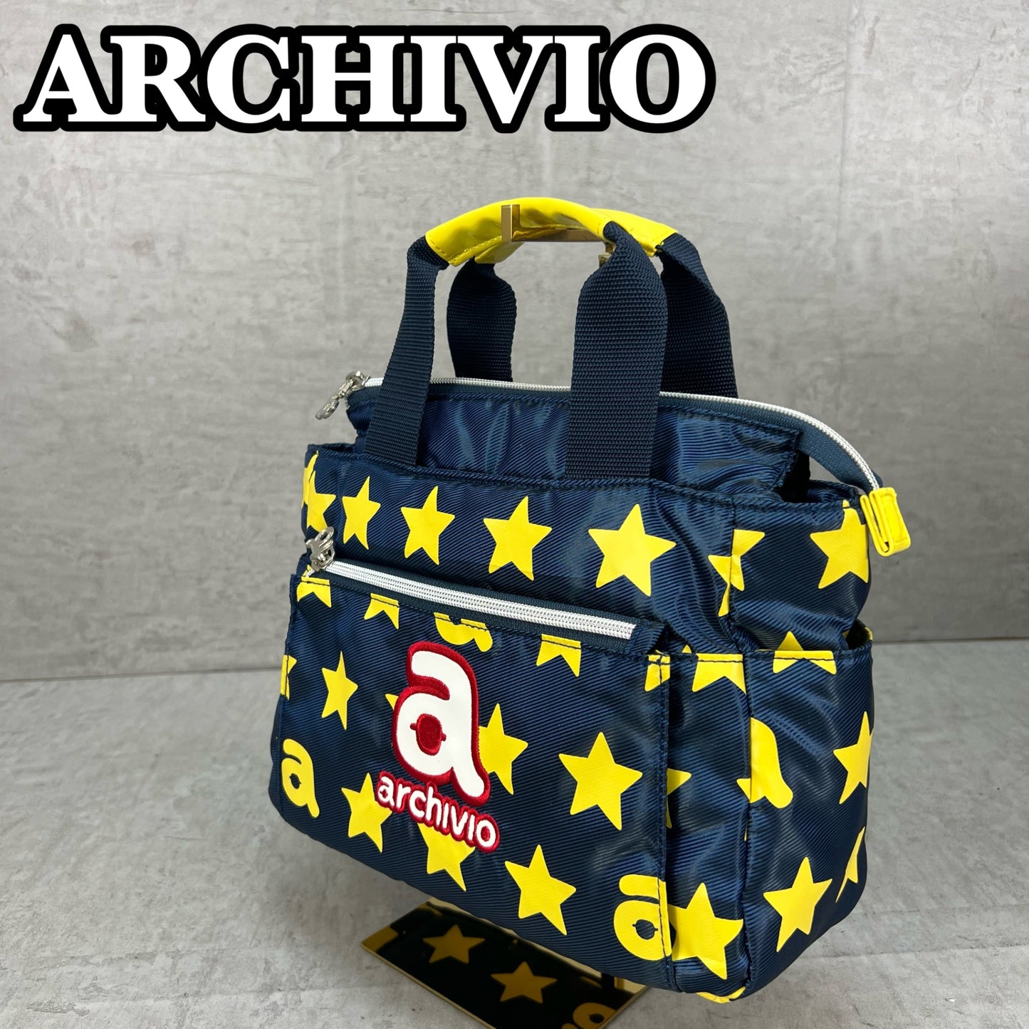 ARCHIVIO　アルチビオ　ゴルフラウンドバッグ　カートバッグ　aロゴワッペン　イエロースター総柄　ネイビーカラーベース　小物入れ